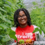 Bailey checking out the vegetables being grown at the KSU Outpost!