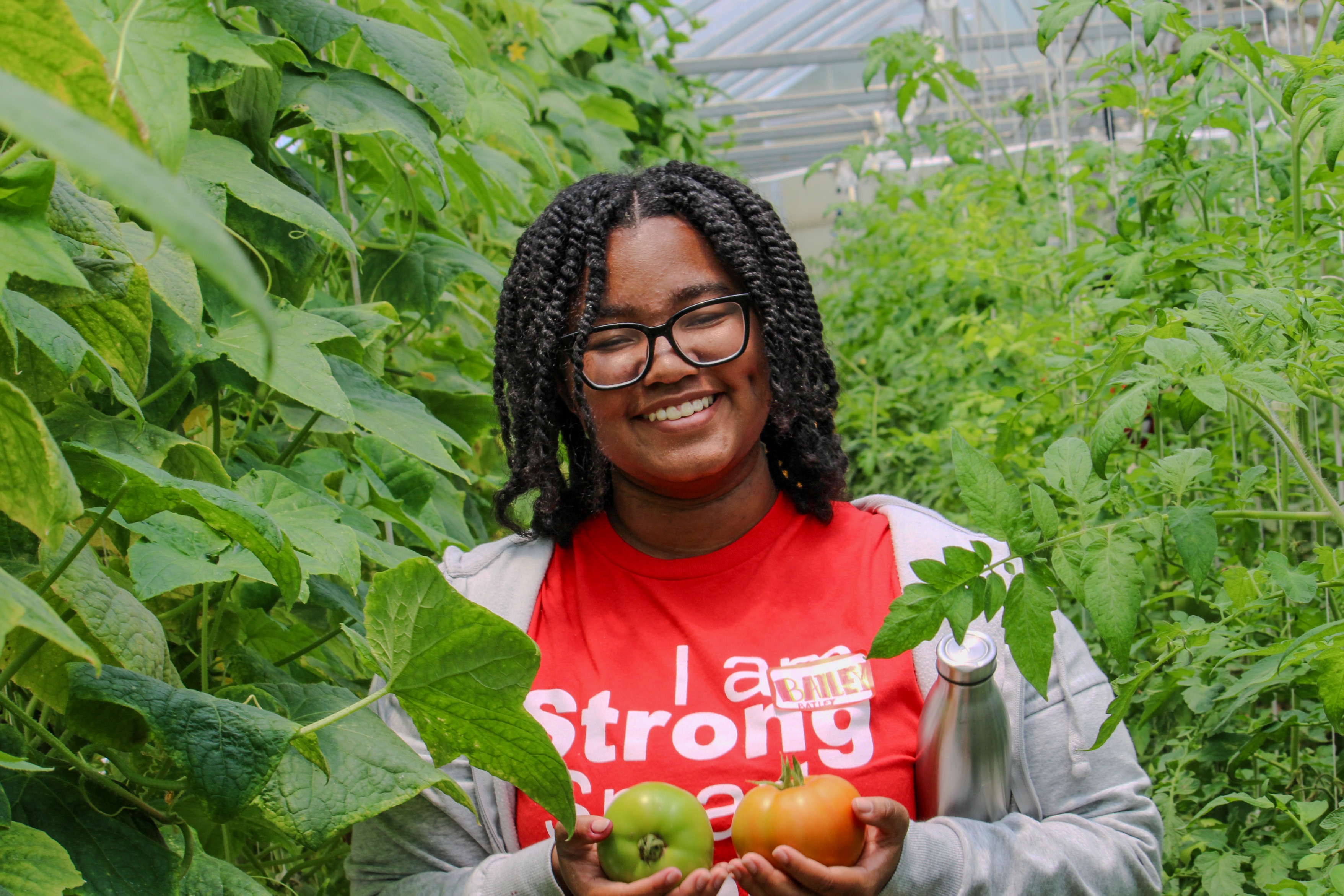 Bailey checking out the vegetables being grown at the KSU Outpost!